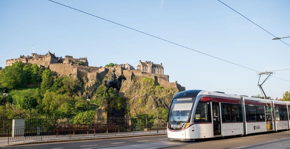 Photo of a tram in front of Edinburgh Castle